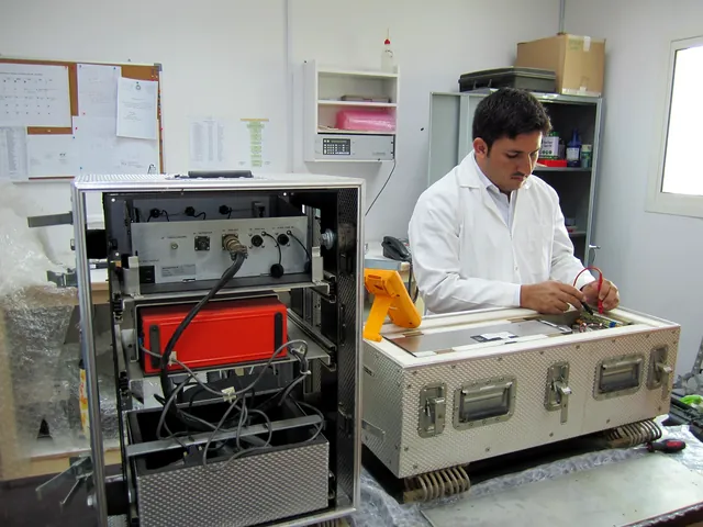 An engineer working on an instrument at the electronics centre