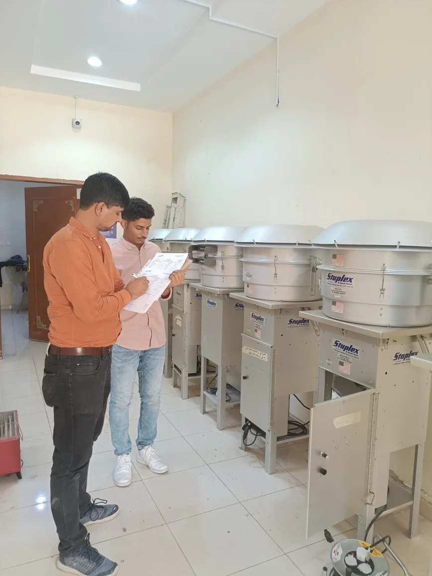 Engineers integrating instrument cabinets