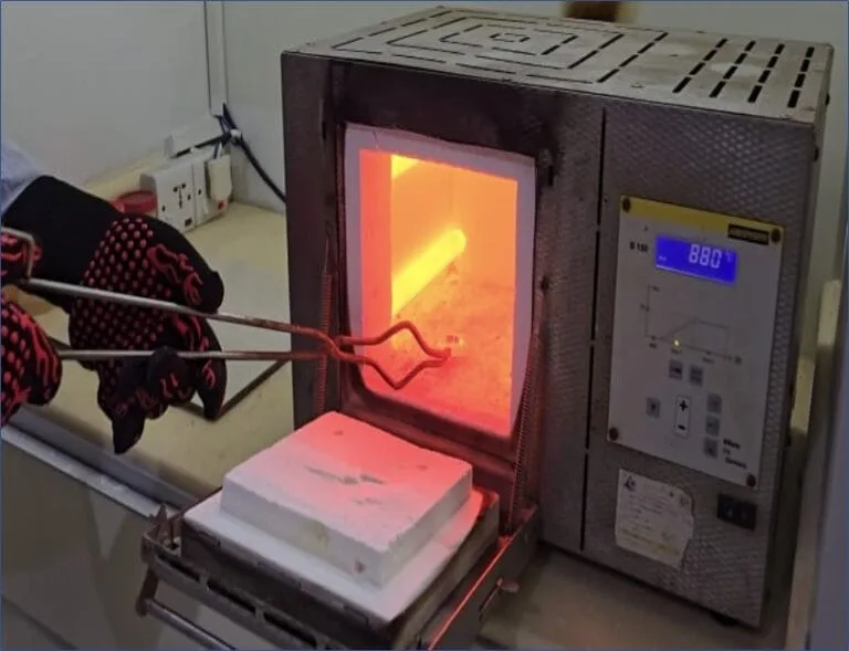 Fire-assay furnace glowing during analysis
