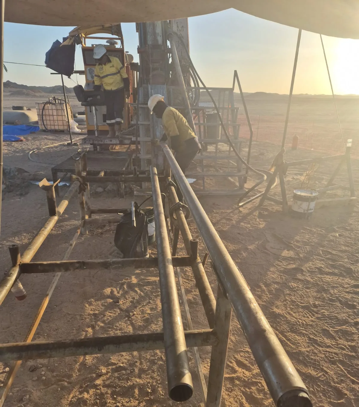 Drill rods and mast during rig setup