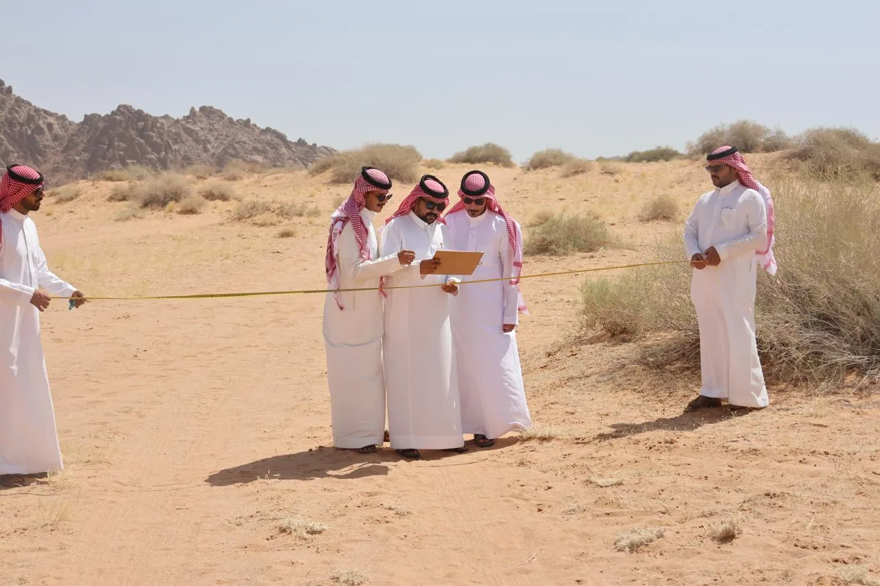 Trainees running a vegetation transect during field training