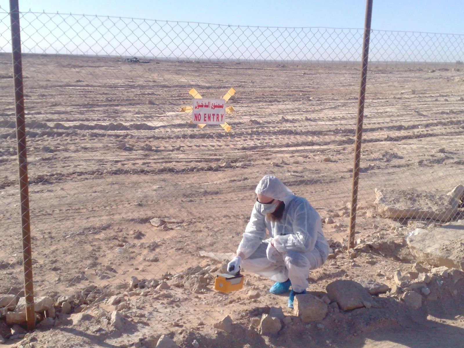 Technician collecting environmental field samples on site